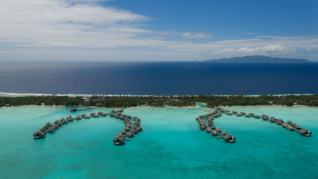 Image of Bora Bora showing both the waters of the lagoon and the surrounding ocean. Hotel is InterContinental Thalasso.